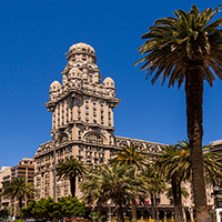 Palacio Salvo in Montevideo Building with palm trees 